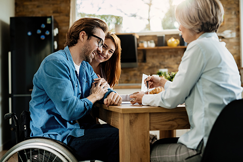 Usda Homeloan 498x332 man in wheelchair working with another woman