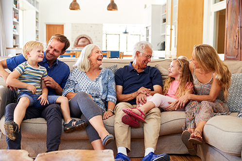 498x332_Family_EstatePlanning extended family sitting around on the couch laughing